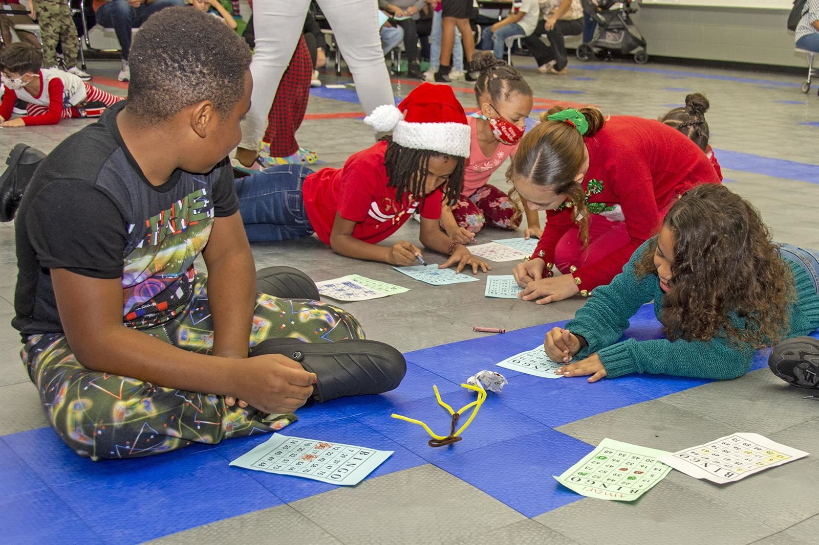 Children participate in bingo during Tipps Elementary School Winter Wonderland Literacy Night.